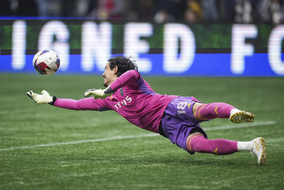 Vancouver Whitecaps goalkeeper Yohei Takaoka dives to make a save against Los Angeles FC during the second half in Game 2 of a first-round MLS playoff soccer match in Vancouver, British Columbia, Sunday, Nov. 5, 2023. (Darryl Dyck/The Canadian Press via AP)