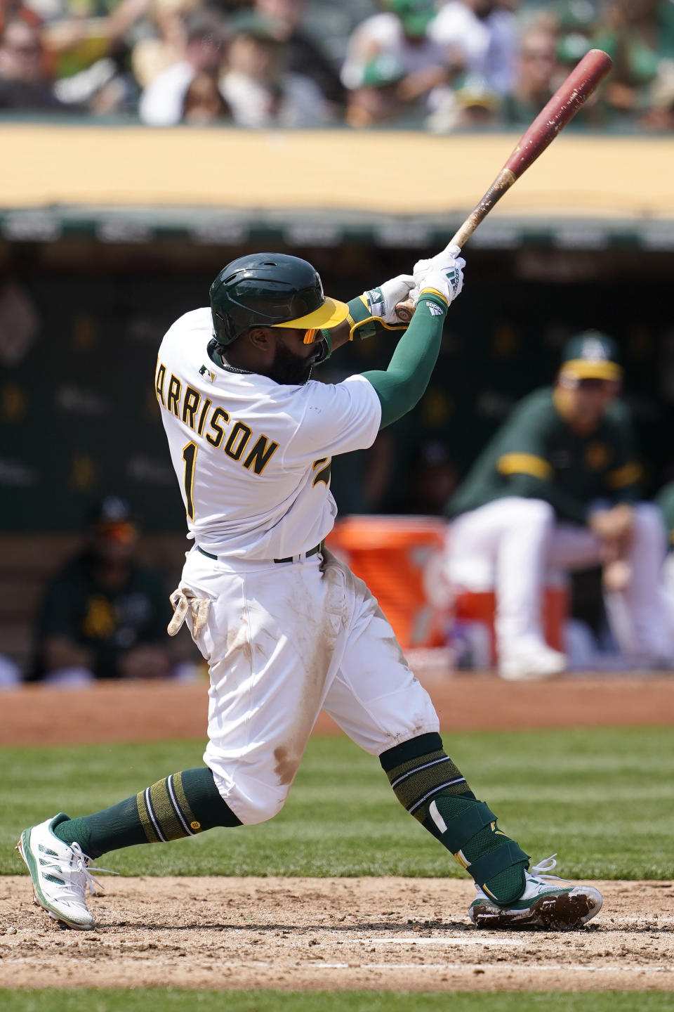 Oakland Athletics' Josh Harrison hits an RBI-double against the San Francisco Giants during the third inning of a baseball game in Oakland, Calif., Saturday, Aug. 21, 2021. (AP Photo/Jeff Chiu)