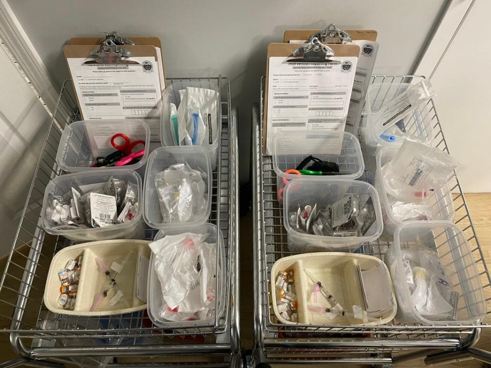 Medication to treat overdoses are arranged on a cart inside a a supervised drug-injection site in Harlem, New York. (Richard Hall / The Independent)