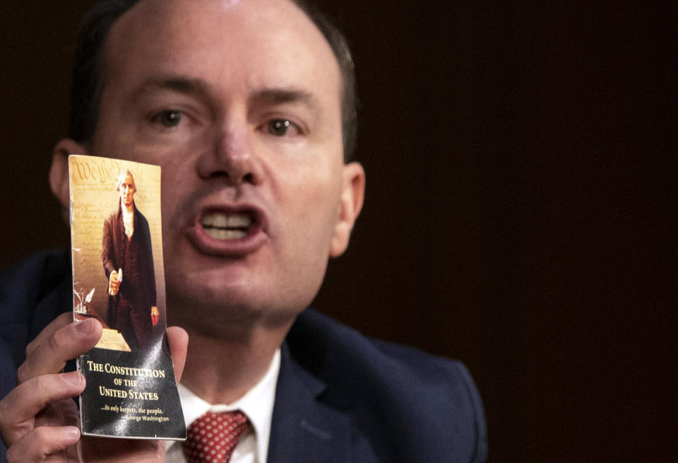 Sen. Mike Lee (R-Utah) holds up a copy of the U.S. Constitution during the Supreme Court confirmation hearing for Judge Amy Coney Barrett on Monday. (Photo: Alex Edelman-Pool/Getty Images)