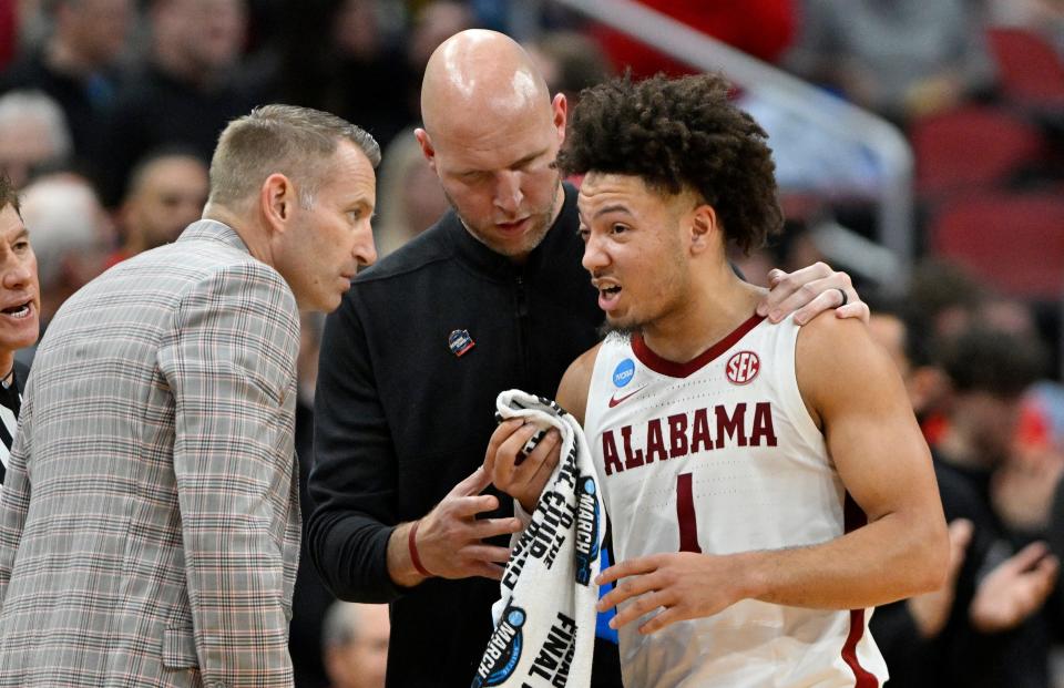 Mar 24, 2023; Louisville, KY, USA; Alabama Crimson Tide head coach Nate Oats looks at guard Mark Sears (1) after he was poked in the eye during the second half of the NCAA tournament round of sixteen against the San Diego State Aztecs at KFC YUM! Center. Mandatory Credit: Jamie Rhodes-USA TODAY Sports