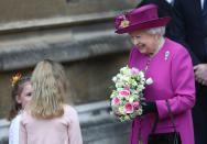 <p>Queen Elizabeth II holds flowers from children after the Easter Mattins Service at St. George’s Chapel at Windsor Castle on April 1, 2018, in Windsor, England. (Photo by Simon Dawson – WPA Pool/Getty Images) </p>