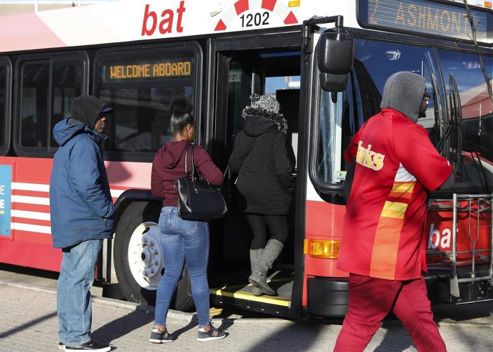 Riders board a Brockton Area Transit bus in an undated file photo.