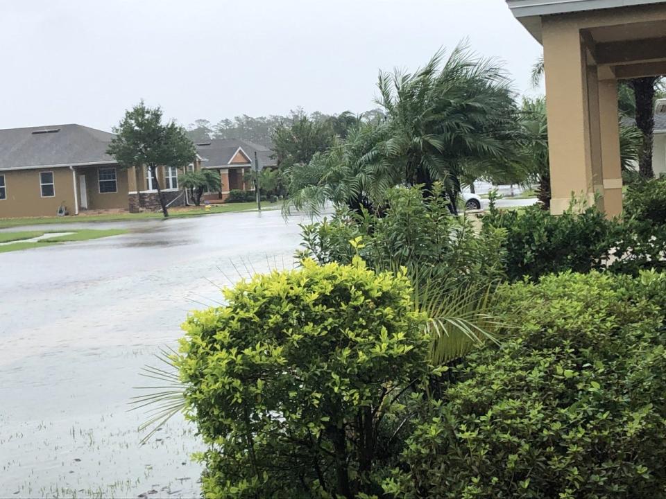 Venetian Bay, a planned community in New Smyrna Beach, Florida, resembles Venice in this view from Mark Harper's porch on Thursday, Sept. 29, 2022, as Hurricane Ian delivers more rain upon a flooded Marsili Avenue.