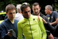 Cycling - Tour de France cycling race - Training ahead of the weekend's start - Coutances, France - 1/07/2016 - Tinkoff team rider Alberto Contador of Spain is surrounded by fans before a training session - REUTERS/Juan Medina