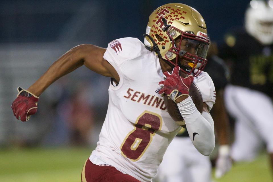 Florida High junior Micah Danzy (8) returns a punt in a game against Lincoln on Nov. 3, 2022, at Gene Cox Stadium. The Seminoles won, 10-9.