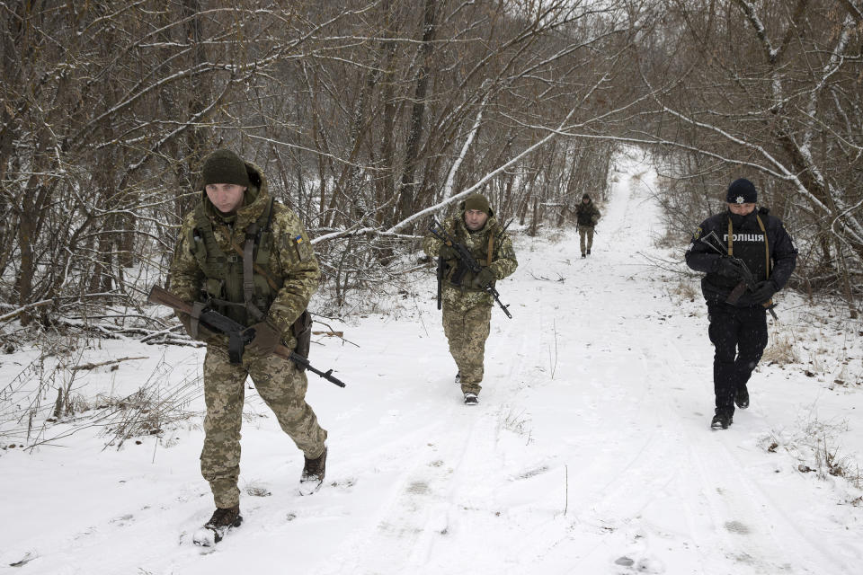 Ukrainian forces on a joint patrol Jan. 9 near the border with Belarus<span class="copyright">Tyler Hicks—The New York Times/REDUX</span>