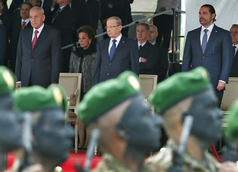 Lebanese Prime Minister Saad Hariri (R), President Michel Aoun (C) and House Speaker Nabih Berri attend a military parade to celebrate the 74th anniversary of Lebanon's independence in Beirut, on November 22, 2017