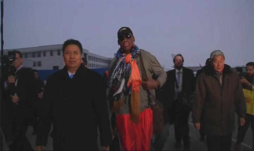 Still image taken from video of retired U.S. basketball star Dennis Rodman walking behind an official upon arriving in North Korea,