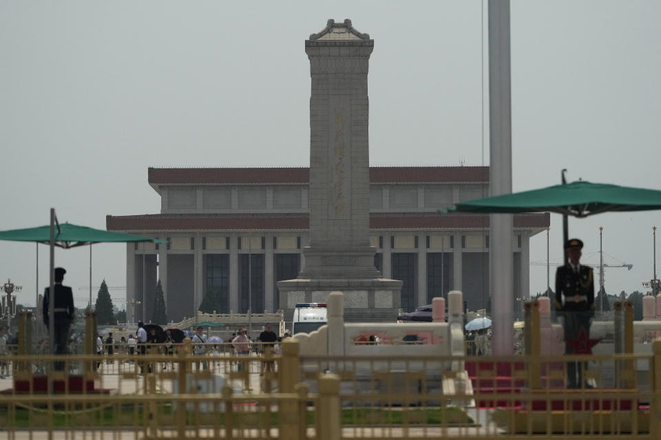 Chinese paramilitary policemen stand on duty at the flag pole near the Monument to the People's Heroes on Tiananmen Square in Beijing, Tuesday, June 4, 2024. Checkpoints and rows of police vehicles lined a major road leading to Beijing's Tiananmen Square as China heightened security on the 35th anniversary of a bloody crackdown on pro-democracy protests. (AP Photo/Ng Han Guan)