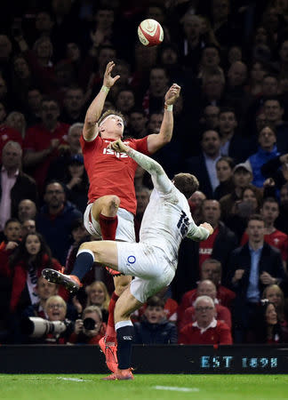 Rugby Union - Six Nations Championship - Wales v England - Principality Stadium, Cardiff, Britain - February 23, 2019 Wales' Josh Adams catches the high ball on his way to scoring their second try REUTERS/Rebecca Naden