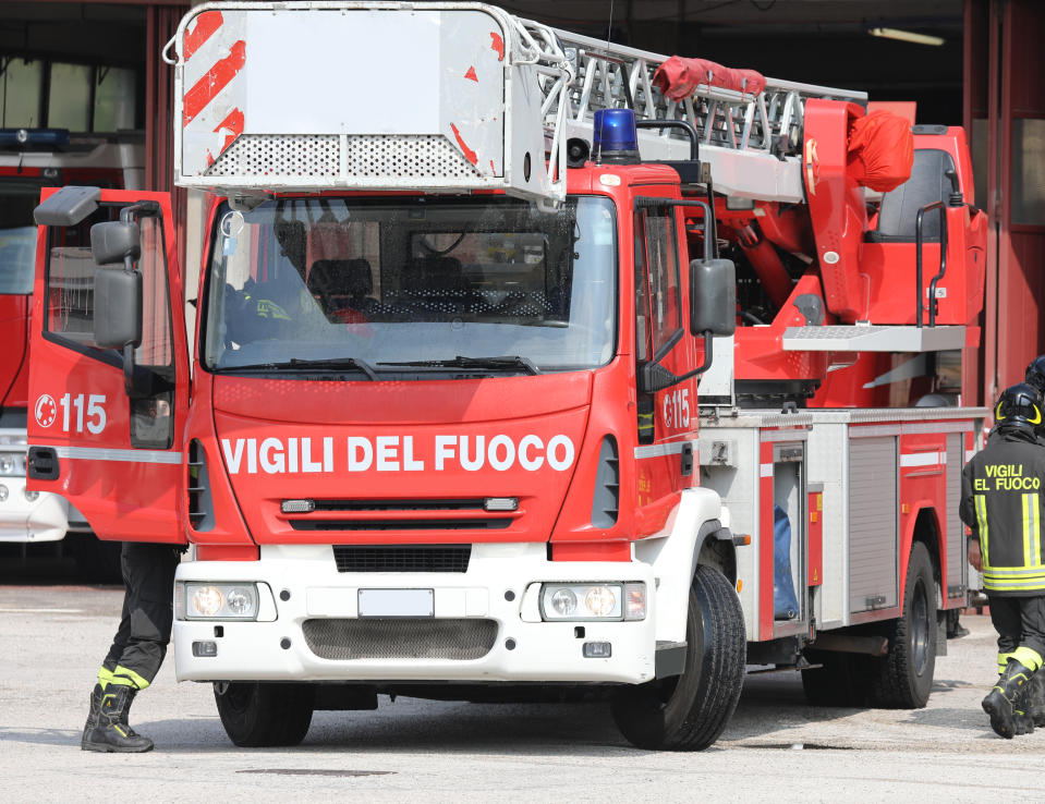 Rome, RM, Italy - May 23, 2019: red fire engine with text VIGILI DEL FUOCO that means Firemen in Italian Language. 115 is the number to call in case of emergency