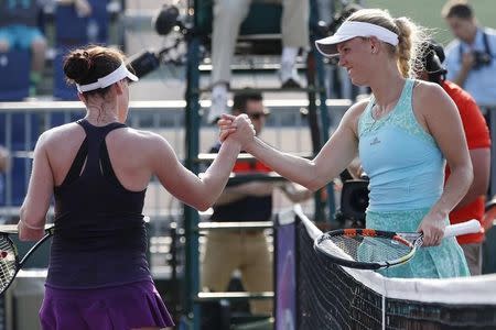 Mar 26, 2015; Key Biscayne, FL, USA; Caroline Wozniacki (R) shakes hands with Madison Brengle (L) after their match on day three of the Miami Open at Crandon Park Tennis Center. Wozniacki won 6-0, 6-1. Mandatory Credit: Geoff Burke-USA TODAY