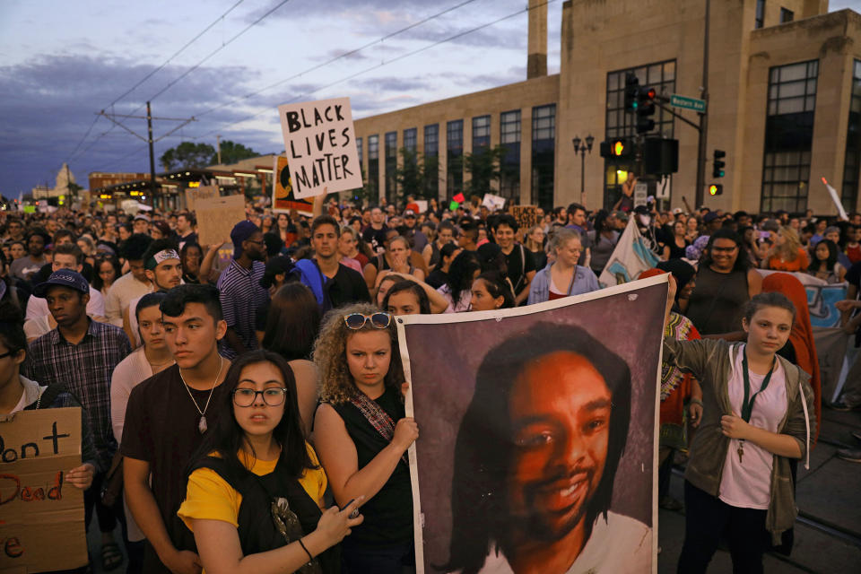 <p>Supporters of Philando Castile hold a portrait of Castile as they march along University Avenue in St. Paul, Minn., leaving a vigil at the state Capitol on Friday, June 16, 2017. The vigil was held after St. Anthony police Officer Jeronimo Yanez was cleared of all charges in the fatal shooting last year of Castile. (Anthony Souffle/Star Tribune via AP) </p>