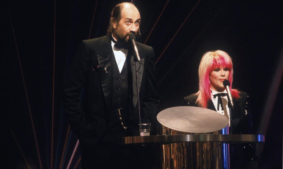 <p>Their height disparity aside, Mick Fleetwood and Samantha Fox were a beyond awkward pairing in 1989 when autocue issues, announcing the wrong guests and general confusion plagued their presenting gig. The disastrous live ceremony heralded the next <a data-i13n="cpos:1;pos:1" href="http://news.bbc.co.uk/1/hi/entertainment/5271104.stm" rel="nofollow noopener" target="_blank" data-ylk="slk:18 years worth of ceremonies being pre-recorded;cpos:1;pos:1;elm:context_link;itc:0;sec:content-canvas" class="link ">18 years worth of ceremonies being pre-recorded</a>, which is quite the legacy. (Dave Hogan/Hulton Archive/Getty Images)</p> 