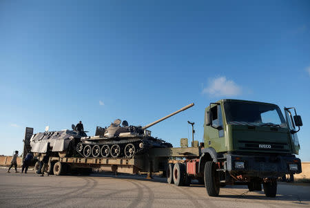 Libyan National Army (LNA) members, commanded by Khalifa Haftar, equip the military vehicles to get out of Benghazi to reinforce the troops advancing to Tripoli, in Benghazi, Libya April 13, 2019. REUTERS/Esam Omran Al-Fetori