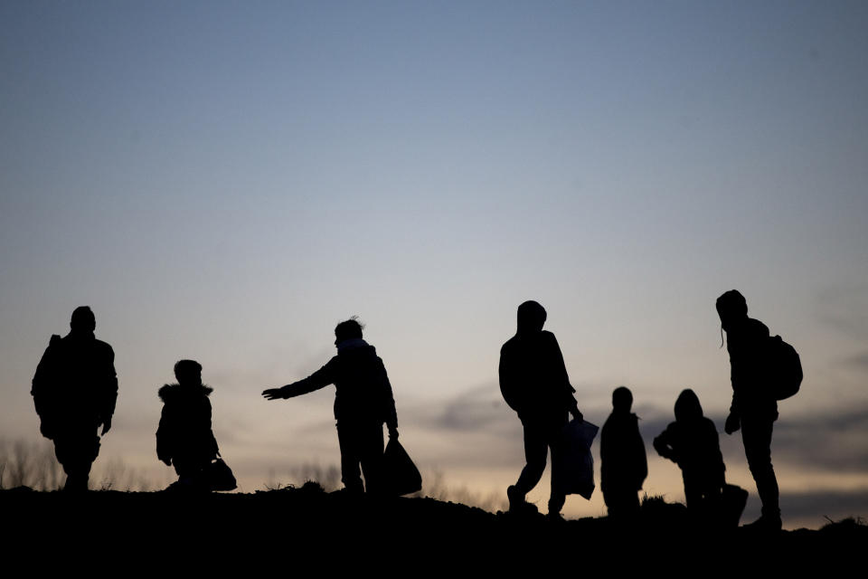 EDIRNE, TURKEY - MARCH 02: Silhouettes of irregular migrants are seen as they continue to wait near the border gate in Edirne, Turkey to reach Greece on March 02, 2020. The number of irregular migrants leaving Turkey for Europe has reached 117,677 on Monday, Turkish Interior Minister Suleyman Soylu said on Twitter. The migrants are leaving Turkey through northwestern Edirne province bordering Greece and Bulgaria. Thousands of migrants flocked to Edirne's Pazarkule border crossing to Greece after Turkish officials announced Friday they would no longer try to stop irregular migrants from reaching Europe. (Photo by Arif Hudaverdi Yaman/Anadolu Agency via Getty Images)