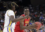 <p>Maryland’s Jalen Smith, right, looks for a shot against LSU’s Naz Reid during the first half of a second-round game in the NCAA men’s college basketball tournament in Jacksonville, Fla., Saturday, March 23, 2019. (AP Photo/John Raoux) </p>