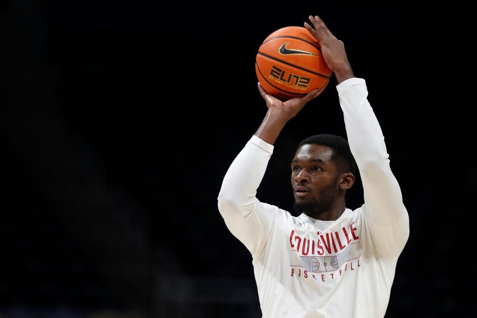 Feb 17, 2024; Pittsburgh, Pennsylvania, USA; Louisville Cardinals forward Brandon Huntley-Hatfield (5) warms up before a game against the Pittsburgh Panthers at the Petersen Events Center. Mandatory Credit: Charles LeClaire-USA TODAY Sports