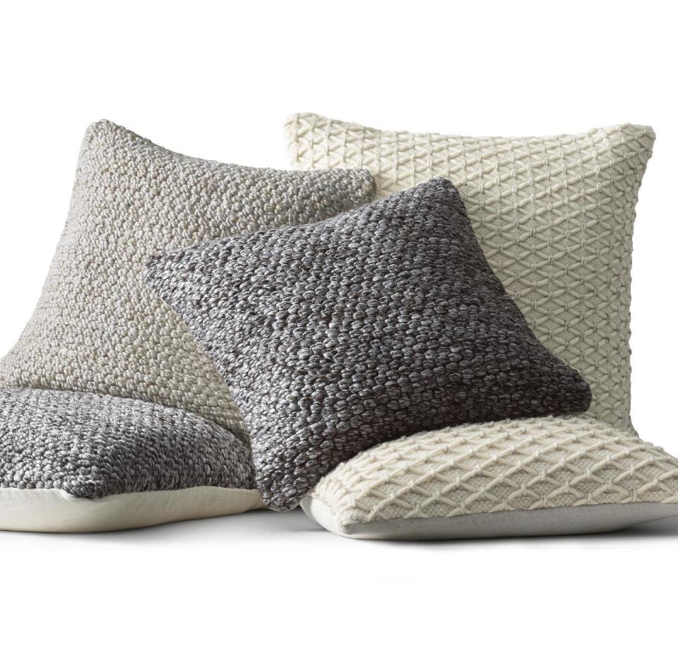 This undated photo provided by RH, Restoration Hardware, shows Ben Soleimani pillow covers. Soft wools, like these covers from Restoration Hardware's new collection, are part of the hygge vibe. (RH, Restoration Hardware via AP)