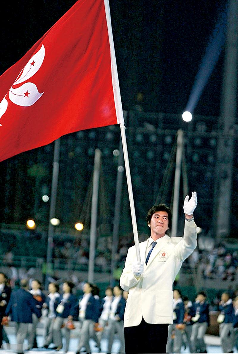 At the Beijing Olympics closing ceremony, Hong Kong team’s flag bearer, rowing star Luo Xiaofeng, served as a marine policeman to continue the Olympic spirit