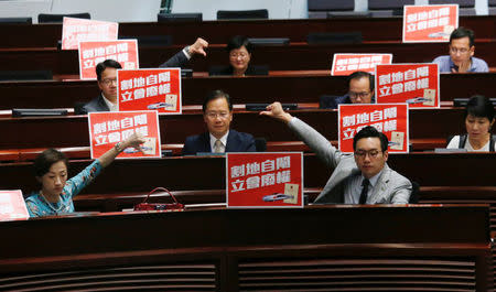 Pro-democracy lawmakers react after Legislative Council passed a controversial bill to introduce mainland Chinese laws inside an upcoming high-speed rail station, in Hong Kong, China June 14, 2018. REUTERS/Bobby Yip