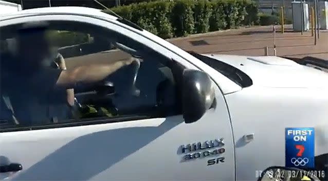 A Perth motorist caught using his phone while driving. Source: 7News