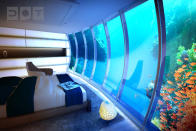 A multifunctional lobby built inside an enormous swimming pool shows the centre of the disc. The area around the underwater part of the complex and diving activities may be watched as they happen on the screens hanging on the lobby walls. This part of the complex is connected to the satellites with glass-walled tunnels cutting through a training pool for divers. (Image credit: www.deep-ocean-technology.com)