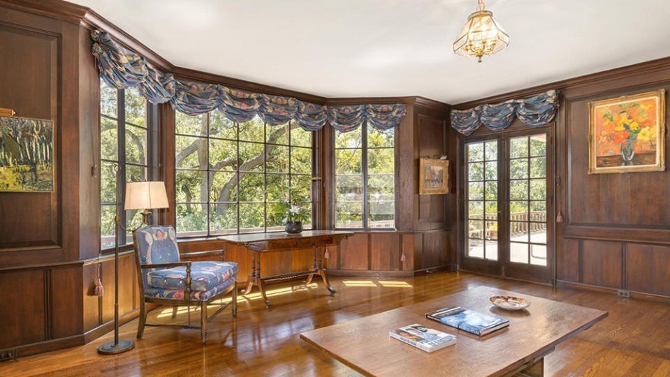 The wood-paneled library. - Credit: Redfin