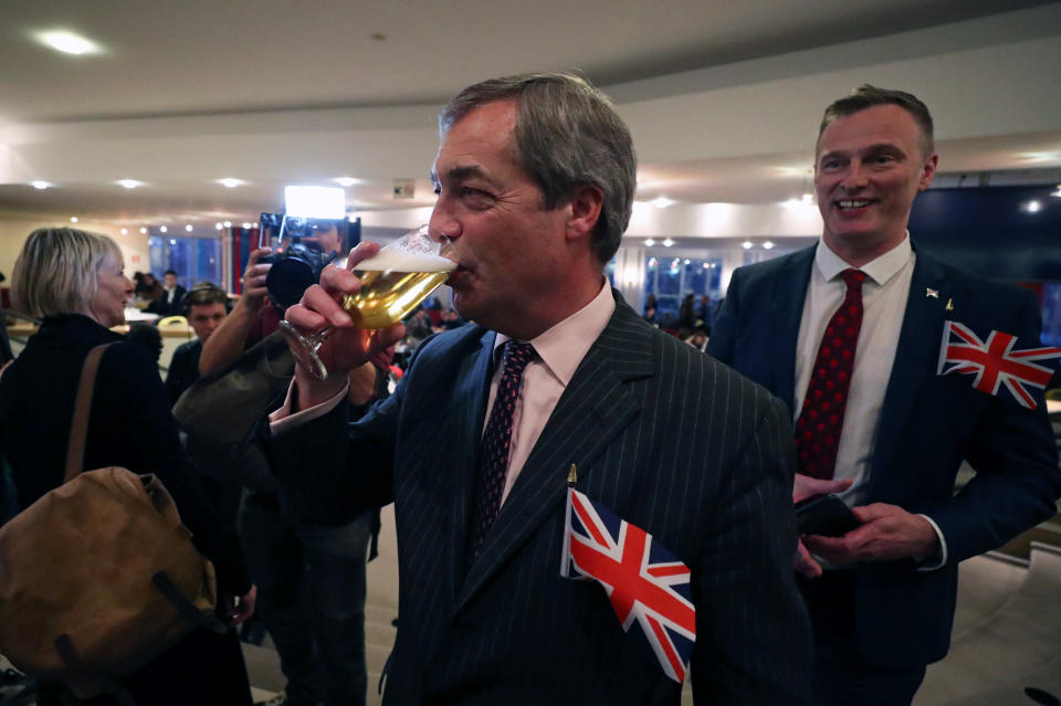 Brexit Party leader Nigel Farage toasts ahead of a vote on the Withdrawal Agreement at the European Parliament in Brussels, Belgium January 29, 2020. REUTERS/Yves Herman