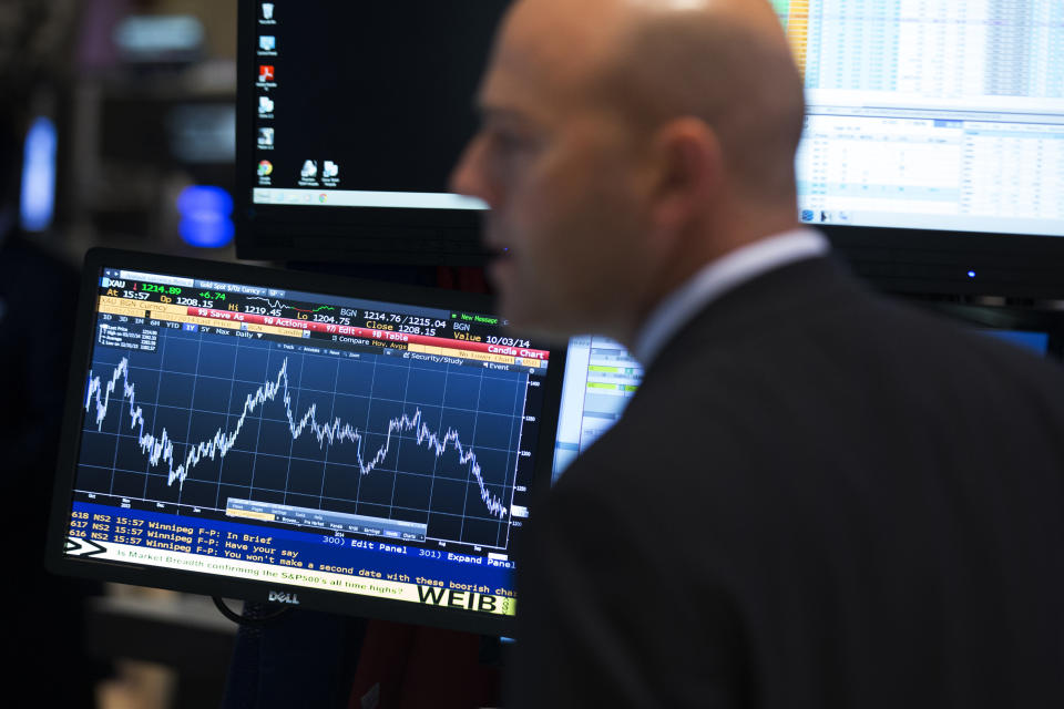 A trader works on the floor of the New York Stock Exchange October 1, 2014. U.S. stocks dropped more than 1 percent on Wednesday as the first diagnosis of Ebola in a patient in the United States spooked investors, and the Russell 2000 index ended in correction territory. REUTERS/Brendan McDermid (UNITED STATES - Tags: BUSINESS)