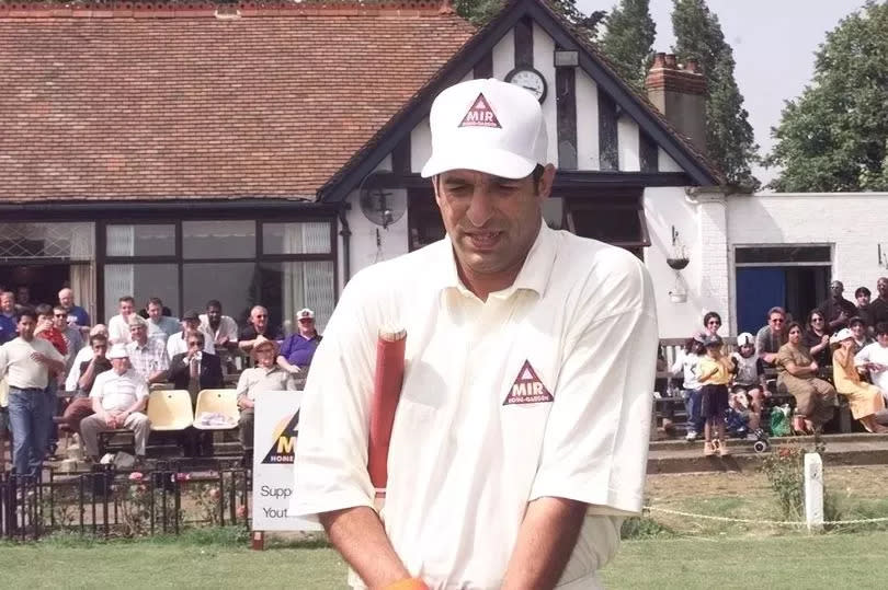 Wasim Akram walks out to bat for Smethwick.