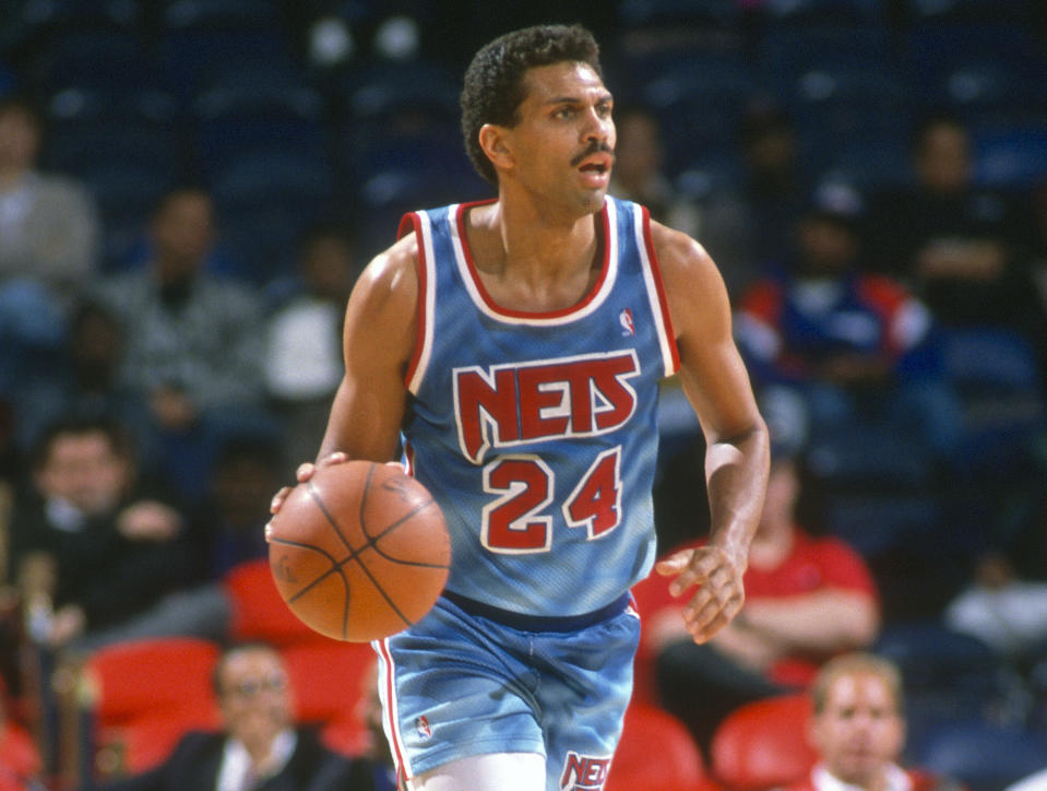 LANDOVER, MD - CIRCA 1991: Reggie Theus #24 of the New Jersey Nets dribbles the ball against the Washington Bullets during an NBA basketball game circa 1991 at the Capital Centre in Landover, Maryland. Theus played for the Nets from 1990-91. (Photo by Focus on Sport/Getty Images) *** Local Caption *** Reggie Theus