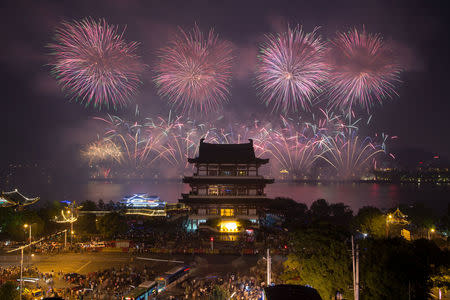 Fireworks explode over Juzi Island to mark the 90th anniversary of the founding of the China's People's Liberation Army in Changsha, Hunan province, China August 1, 2017. REUTERS/Stringer