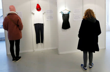 Visitors are seen at the exhibition "What Were You Wearing?" that showcases the stories of U.S. student rape victims through representations of the outfits they wore during their assault, in the Brussels district of Molenbeek, Belgium January 16, 2018. REUTERS/Francois Lenoir