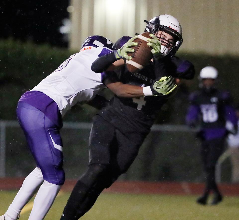 Mission Oak's Cameron Azevedo hauls in a pass from Mission Oak's Daniel Gonzalez for a touchdown against Washington Union during their Central Section Division III high school football semifinal playoff game in Tulare, Calif., Friday, Nov. 17, 2023.