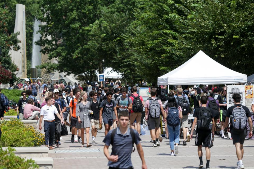 Students walk across Purdue University's campus Aug. 23 in West Lafayette, Ind.