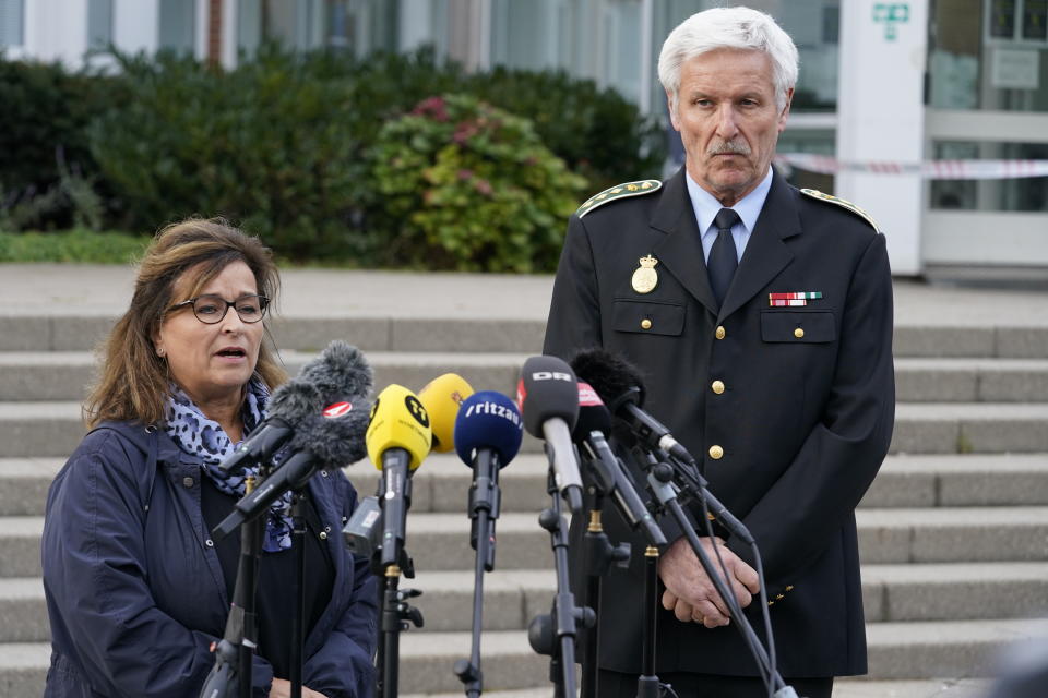 Mogens Lauridsen of the Copenhagen Police and Head of Herstedvester Prison Hanne Hoeegh Rasmussen, left, speak to the media in front of the police station in Albertslund, Denmark, Tuesday Oct. 20, 2020. Danish man, Peter Madsen, convicted for torturing and murdering a Swedish journalist on his homemade submarine escaped the suburban Copenhagen jail where he is serving a life sentence but was recaptured nearby Tuesday. (Mads Claus Rasmussen/Ritzau Scanpix via AP)