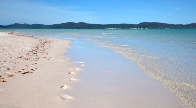 Whitehaven Beach is accessible by sea plane, helicopter or boat. Photo: Getty