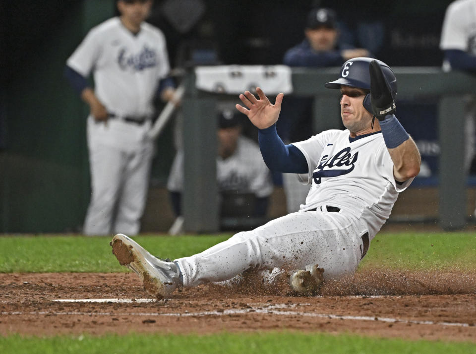 Houston Astros' Alex Bregman slides into home plate to score during the fifth inning of a baseball game against the Kansas City Royals, Saturday, Sept. 16, 2023, in Kansas City, Mo. (AP Photo/Peter Aiken)