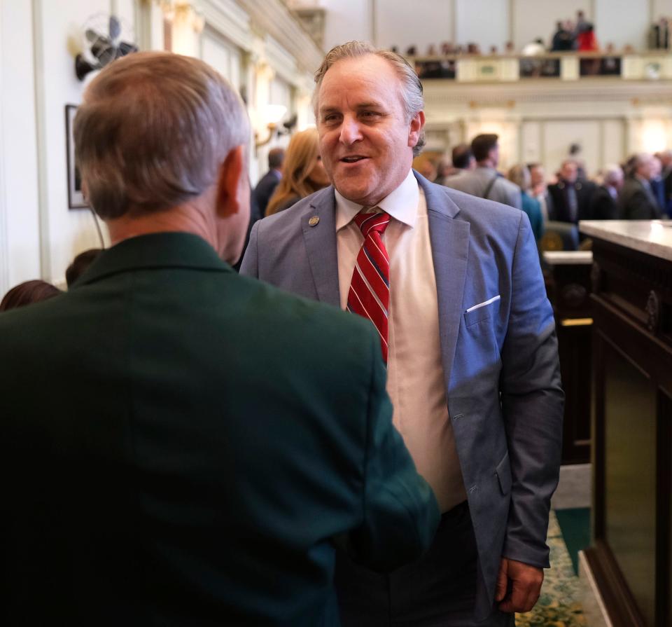 Senate President Pro Tempore Greg Treat greets a House sergeant at arms Monday as he arrives for Gov. Kevin Stitt's State of the State address.