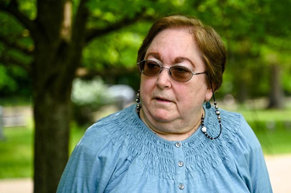 Friends of Lansing's Historic Cemeteries president Loretta Stanaway talks about the importance of maintaning grave markers on Tuesday, May 23, 2023, at Mt. Hope Cemetery in Lansing.