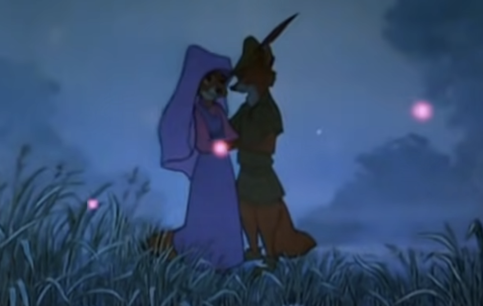 robin hood and maid marian outside at night