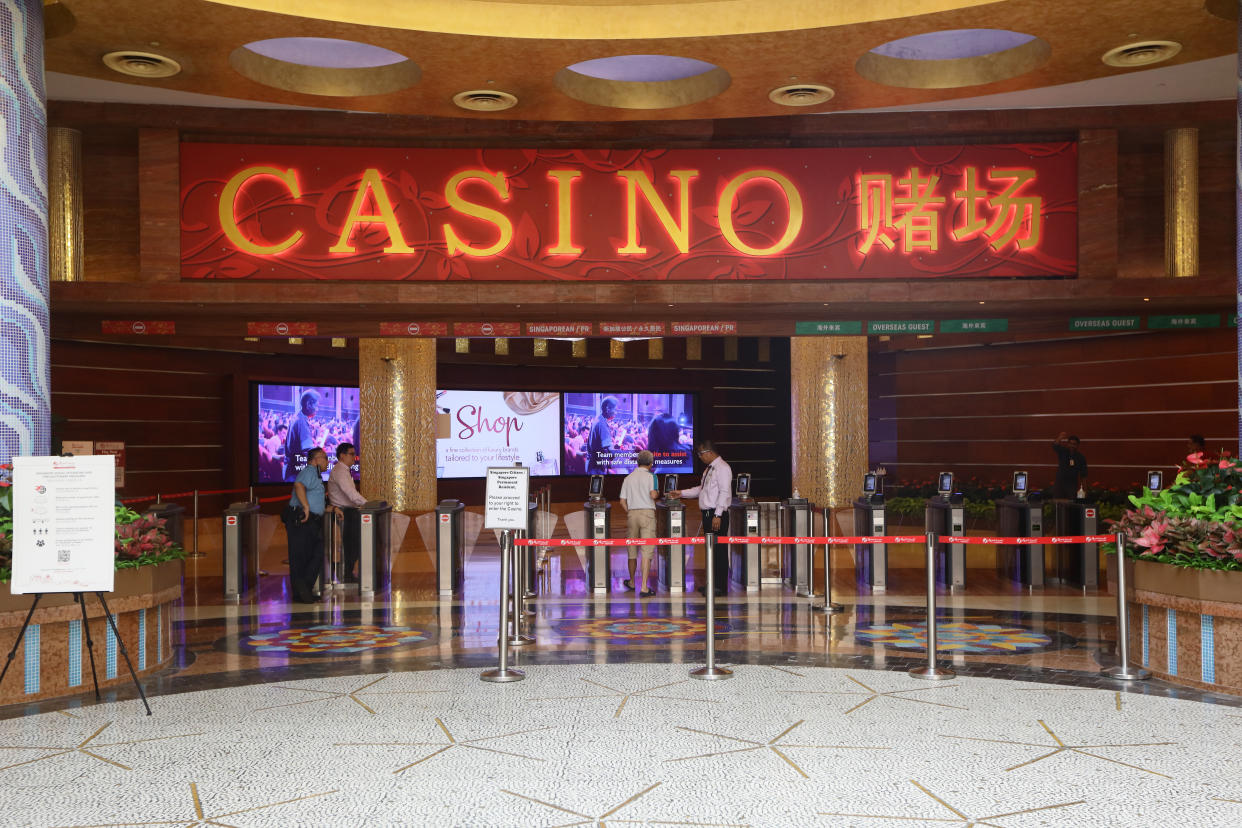 SINGAPORE - APRIL 04:  A man is seen entering a casino at Resort World Sentosa on April 4, 2020 in Singapore. Yesterday, Singapore's Prime Minister Lee Hsien Loong announced stricter measures to contain the spread of the COVID-19 cases by closing non-essential workplaces and schools temporarily for a month from April 7.  (Photo by Suhaimi Abdullah/Getty Images)