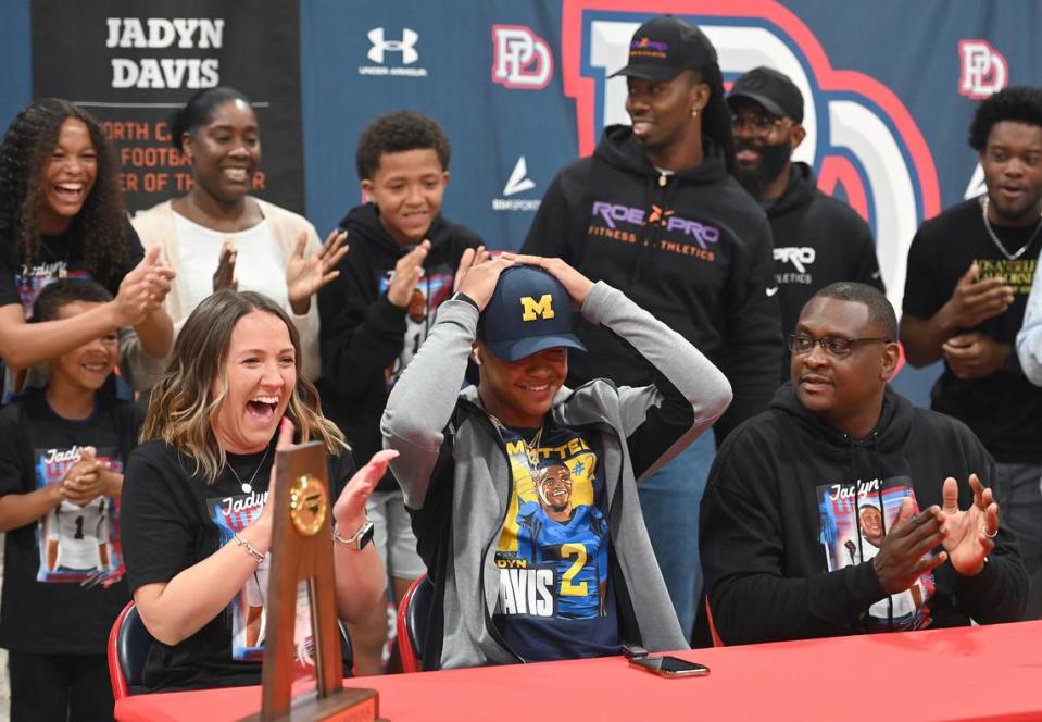 Cheers and applause surround Providence Day quarterback Jadyn Davis as announces that he will attend the University of Michigan to play football on Friday, March 31, 2023. Davis is a top 15 national recruit. JEFF SINER/jsiner@charlotteobserver.com