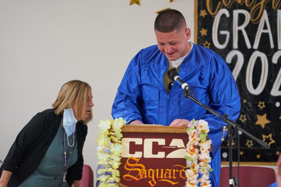 John Kawewehi, a graduating inmate at the Saguaro Correctional Center in Eloy, gives a speech during the graduation ceremony on May 12.