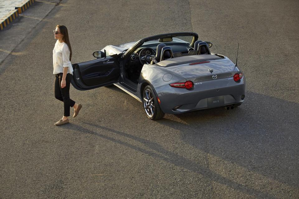 This photo provided by Mazda shows the Mazda MX-5, one of the least expensive but most enjoyable convertibles on the market. (Courtesy of Mazda North American Operations via AP)