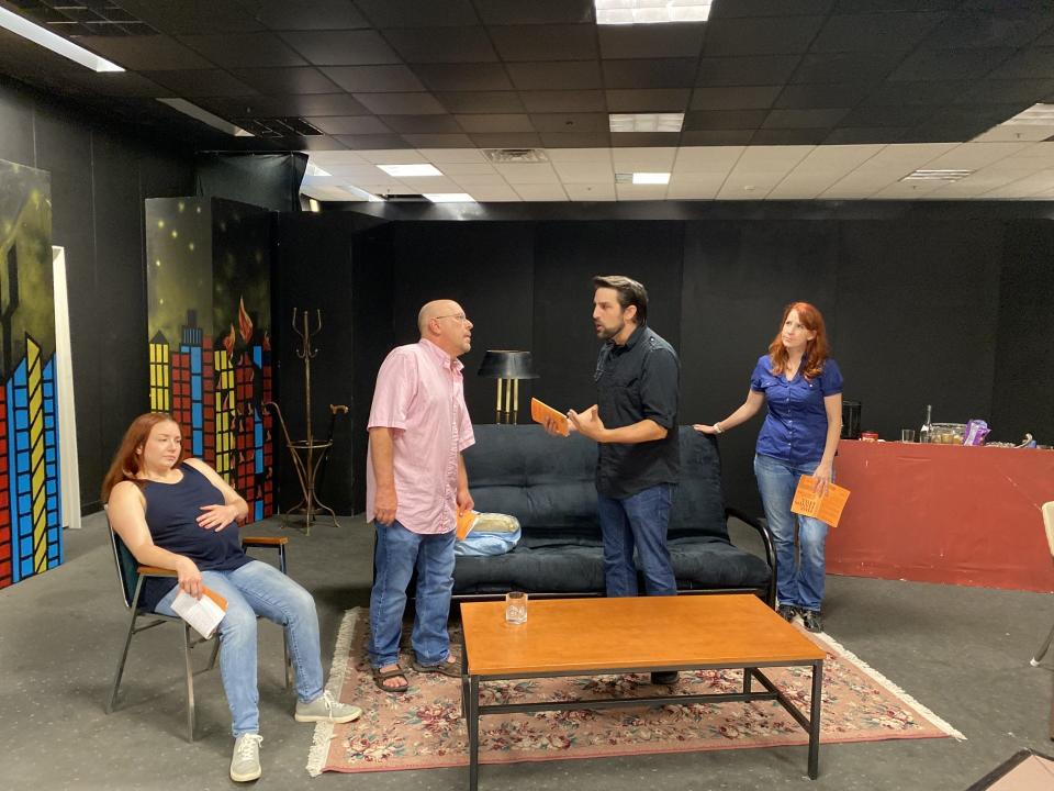 Members of Monroe Community Players (from left) Kori Bielaniec, Brian Burchette-Ross, Adam Carey and Kelly White rehearse a scene from "Time Stands Still."