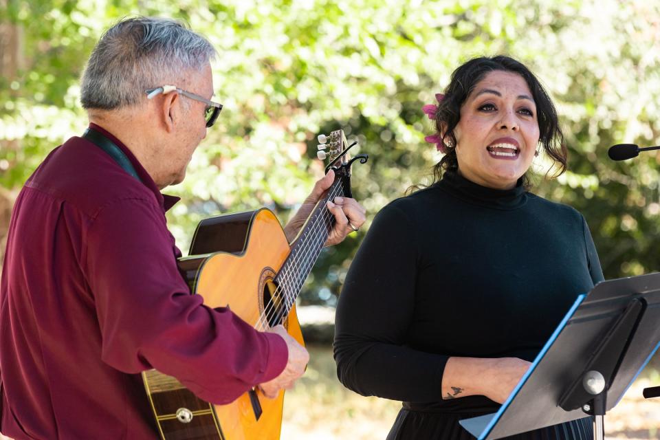 Carla Arancibia and Luis Ulloa perform a musical number during a gathering of community members and community leaders to celebrate the start of Hispanic Heritage Month at the Suazo Business Center in Salt Lake City on Friday, Sept. 15, 2023. | Megan Nielsen, Deseret News