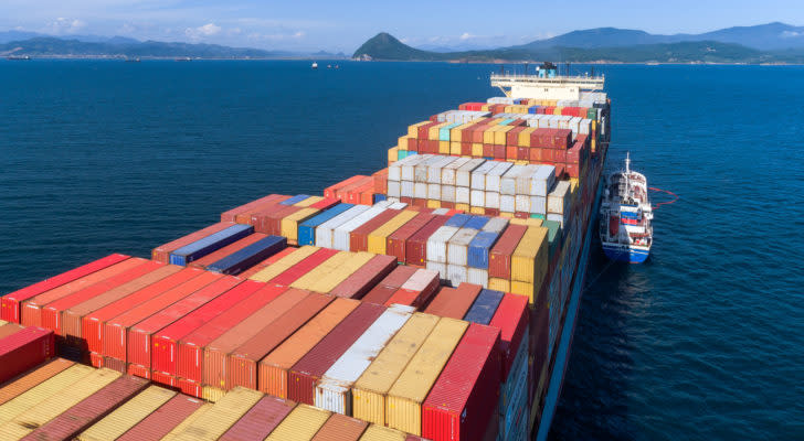 a cargo ship in the middle of the ocean